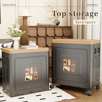 Boîte de rangement pliable moderne en polypropylène écologique avec couvercle et roulettes, utilisée pour organiser les vêtements et les couvertures