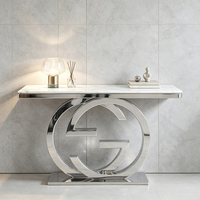 Table console de luxe à double anneau entrelacé avec base sur piédestal, plateau en marbre, table d'entrée en acier inoxydable, table de décoration artistique moderne