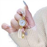 Nouveauté, bracelet-montre pour femme en alliage léger et luxueux, élégant, double rangée de perles d'eau douce, créatif, haut de gamme, sens du style