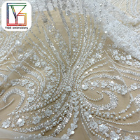 Tissus en dentelle de tulle brodés de fleurs 3D à la vente chaude, tissus en dentelle de maille perlée de luxe avec des paillettes pour robes de mariée
