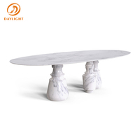 Mesa de Comedor de Estilo Moderno: Tablero Ovalado de Mármol, Base Única Tipo Columna, que Agrega Elegancia a los Espacios de Comedor Contemporáneos