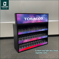 Présentoir mural métallique personnalisé pour cigarettes et tabac, idéal pour les magasins de tabac en Moyen-Orient et en Afrique