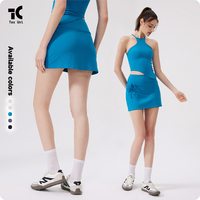 Ensemble de sport sexy à dos ouvert avec coussinets de poitrine fixes, débardeur de fitness, short taille haute deux pièces uni et jupe de badminton, tennis, yoga