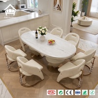 Ensemble de table à manger ovale de luxe avec accents en cristal et 6 chaises rembourrées, idéal pour l'ameublement de villas, hôtels et restaurants