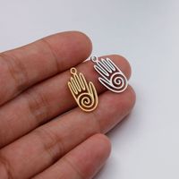 Jingxiang transfrontalier nouveau acier inoxydable évidé Fatima bouddha main bijoux accessoire bricolage pendentif