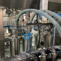 Machine de remplissage automatique de haute précision pour liquides, lotions et pâtes en bouteilles plastiques et en verre (99,5 % de pureté) - Vente en gros