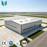 Hangar préfabriqué moderne en structure acier pour avions privés, haute capacité de charge, pour stockage aéronautique de luxe et lieux sportifs