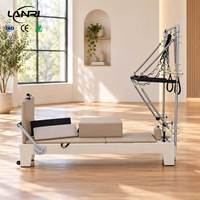 Machine de Pilates Réformateur en Bois d'Érable Durable et Réglable avec Demi-Tour pour Usage en Studio