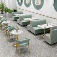 Ensemble de mobilier pour hôtels et restaurants : banquettes rembourrées, chaises de salle à manger, tables à plateau en marbre pour projets de cafés et de salons