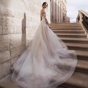 White Long Sleeve V Neck Mermaid Wedding Dress With Floral Print And Trailing Skirt For Elegant Bridal Wear - Product Image 3