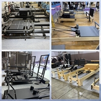 Machine de Pilates Reformer blanche avec cadre en aluminium, chariot large et roulements silencieux pour l'entraînement professionnel en studio