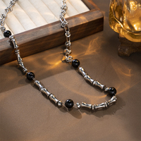 Collier Mlluki en acier inoxydable avec motif os, noir et blanc, style hip-hop, bijoux en pierre naturelle noire pour femme, idéal comme cadeau