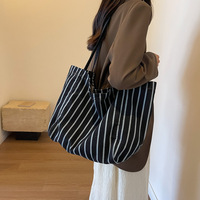 Vente en gros de sacs cabas tendance personnalisés rayés en tissu et coton de couleur sac à provisions lourd imprimé sac de plage en toile avec poignée en corde