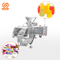 Machine automatique de comptage et d'emballage de bonbons, boutons, comprimés et capsules en sachet