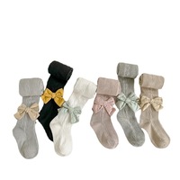 Vente en gros de leggings ras du cou pour enfants combinaison avec nœud de couleur unie et motif papillon printemps automne chaussettes pour bébés pour filles