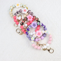 Porte-clés et porte-monnaie à perles en silicone style floral pour femme