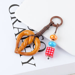 Super mignon en forme de nourriture en métal porte-clés mode dessin animé alcalin eau pain pendentif tissé à la main chocolat porte-clés lanière - Product Image 1