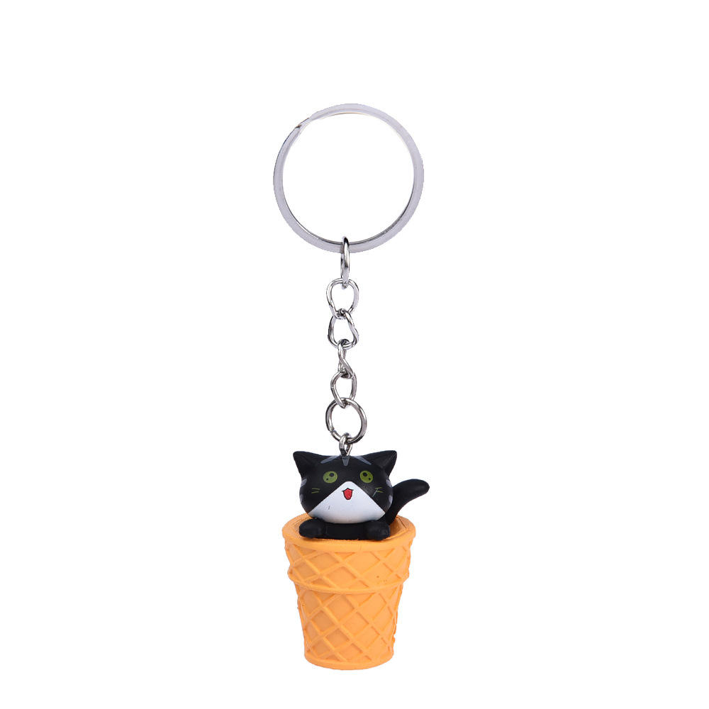 Black open mouth cat + yellow bucket keychain