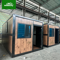 Casetta Prefabbricata a Basso Costo Abitazione Container Pieghevole Durevole Struttura in Acciaio per Ufficio Negozio Garage Casa Mobile Portatile