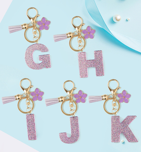 Llavero <span class=keywords><strong>de</strong></span> resina DIY con letra inicial del alfabeto inglés <span class=keywords><strong>de</strong></span> 26 letras, color morado con purpurina, colgante <span class=keywords><strong>de</strong></span> flor morada y borlas, para bolso - Product Image 1