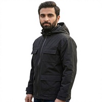 Blouson bomber imperméable à capuche noir personnalisé unisexe coupe-vent zippé avec poches et doublure en polyester pour une utilisation en extérieur en hiver