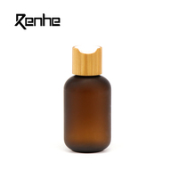 Botol Plastik Silinder PET Amber Frosted Berkualitas Tinggi 250ml Dengan Tutup Bambu Untuk Krim Wajah, Masker, Sampo, Losion, Penggunaan Kosmetik