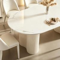Ensemble de table et chaises de salle à manger ovales en pierre frittée blanc crème de luxe, design cannelé, pour villa, hôtel, restaurant