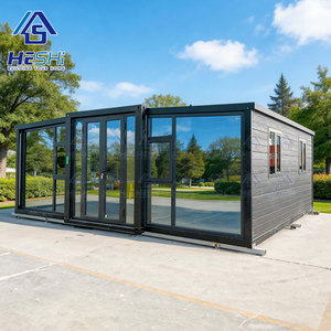 Casa Contenedor Moderna HESHI, Oficina Rectangular Prefabricada, Casa Modular con Paredes de Vidrio y Marco Negro - Product Image 1