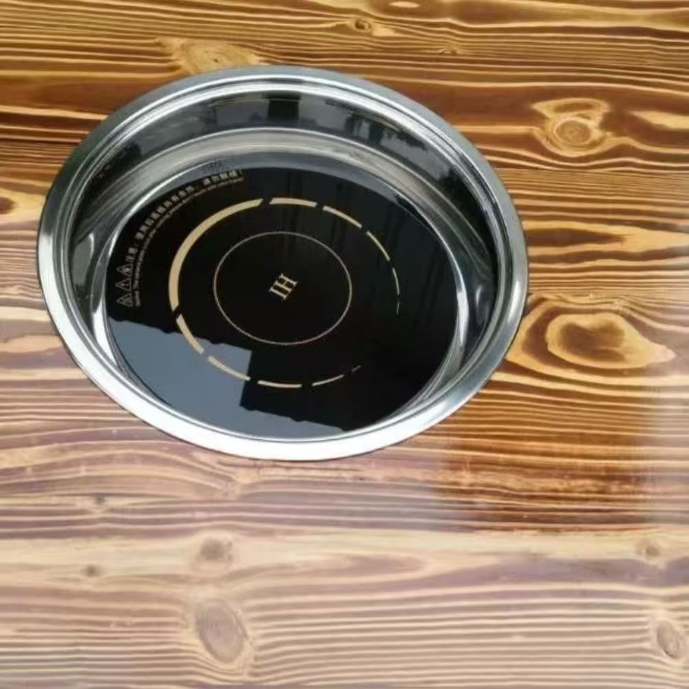 Table ronde de 1,2 mètre avec plaque à induction encastrée.