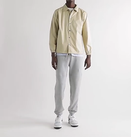 Coupe-vent imperméable en polyester et coton floqué brodé d'un écusson chenille personnalisé OEM Veste légère pour entraîneurs pour hommes