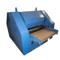 Machine à carder la laine, machine à peigner les fibres de coton et à fabriquer des bandes de fibres