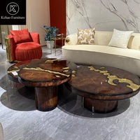 Ensemble de tables basses de luxe italiennes en bois de palissandre avec incrustations en laiton, table centrale ronde irrégulière pour salon de villa