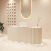Bureau de réception d'angle incurvé en forme de L minimaliste pour magasin de vêtements de Salon de beauté pour comptoir de caisse Bar de réception dentaire