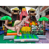 Structure gonflable à thème volcan dinosaure avec toboggan, combo de jeux gonflables pour enfants, idéal pour les fêtes en plein air et les aires de jeux.