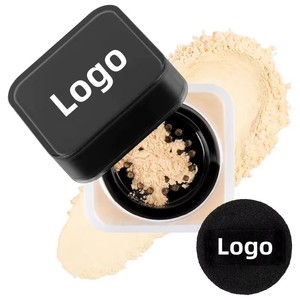 Luxury brand highlights matte loose powder with a small powder puff for controlling oil and providing organic setting. - Product Image 2