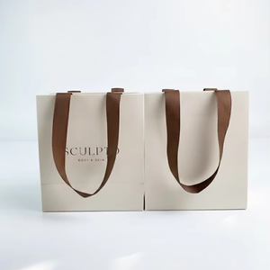 ถุงของขวัญกระดาษหนาสีชมพูสดแบบสั่งทำพิเศษระดับไฮเอนด์ MH พร้อมหูหิ้วริบบิ้นหรูหรา สำหรับบรรจุภัณฑ์เครื่องสำอางสำหรับร้านแฟชั่น - Product Image 1