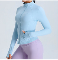 Veste de yoga en gros à fermeture éclair, manches longues, coupe ajustée, avec trou pour le pouce, col montant, pour la course et le sport