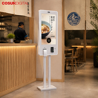 Kiosco de autoservicio con pantalla táctil en japonés para pedidos digitales, montado en la pared, para tiendas de comida rápida.