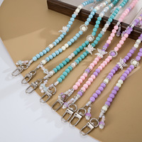 Chaîne de téléphone bandoulière tendance, faite main, ornée de perles et de strass, style Ins, avec pendentif anti-perte pour téléphone et breloque de sac, motif papillon ajouré