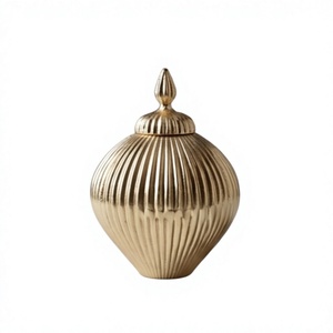 Luxury <b>Gold</b> Ribbed Metal Storage Jar With Pointed Finial Lid Date And Dry Fruit Container Tabletop Decor - Product Image 1