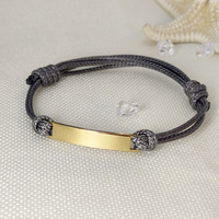 Bracelet en paracorde en acier inoxydable poli à prix d'usine avec accessoires en anneaux métalliques personnalisés