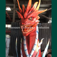 Tête de dragon géante animatronique faite à la main ou décorations de monstres artificiels pour aire de jeux
