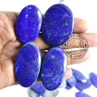 Cabochons ovales en lapis-lazuli naturel IRFAN GEMS en gros - Tailles personnalisées, pierres précieuses bleues polies avec jeu de couleurs/effet de feu pour la joaillerie