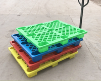 Venta al por mayor suelo de plástico proveedor de paletas 1200*1000 48x40 HDPE anidado 4 vías de entrada tipo de exportación paleta de plástico precios