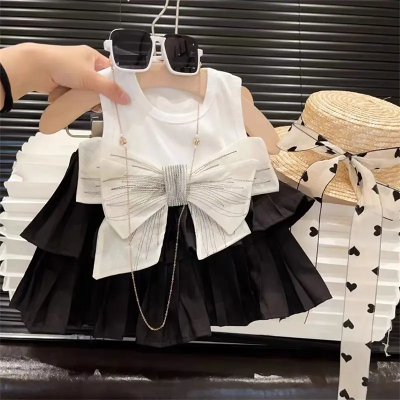 Conyson nueva llegada Corea casual verano moda boutique niño primavera bowknot ropa al por mayor camiseta sin mangas chica Honda falda