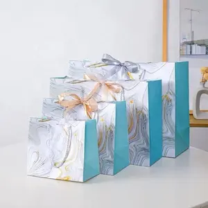 Logotipo personalizado de lujo Boutique ropa joyería Mini pequeña bolsa de papel de regalo con lazo de lazo