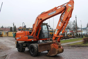 Excavatrice sur pneus d'occasion Doosan DX140W-7 d'origine - Product Image 2