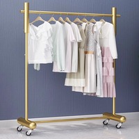 Présentoir mobile moderne en métal écologique sur pied pour magasin de vêtements féminins, idéal pour vitrine, diffusion en direct et chambre