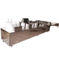 Ligne de production automatique de barres protéinées énergétiques pour la fabrication de barres de snacks au sésame pour la fabrication de bonbons à la cacahuète et de chikki Machine à fabriquer des barres Turron