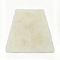 Tapis rectangulaire grand format Starfish Morden en peluche unie, polyester, antidérapant, avec envers enduit de PVC, fabriqué à la machine, couleur crème pour la maison